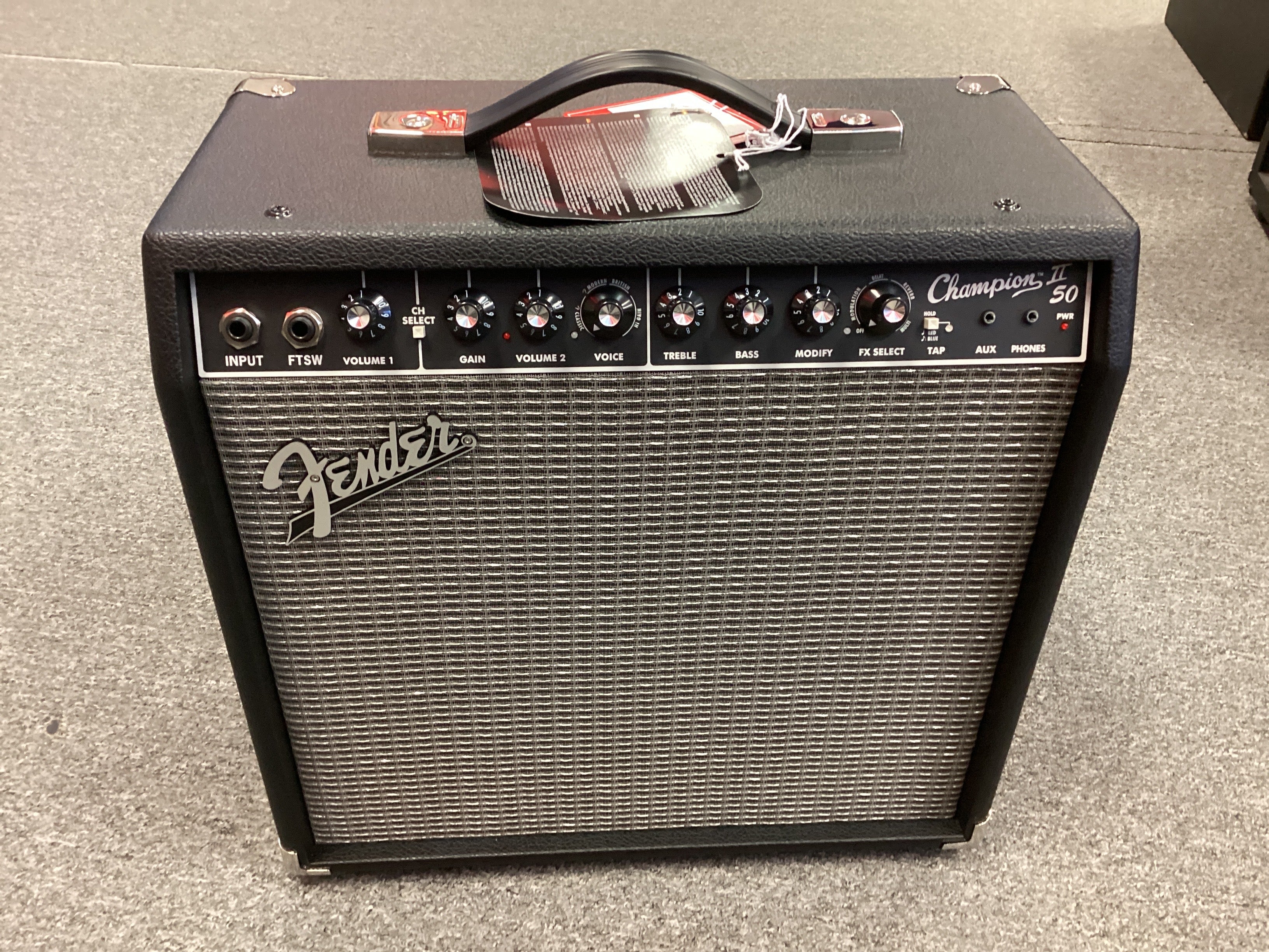 Fender amplifier on a gray floor