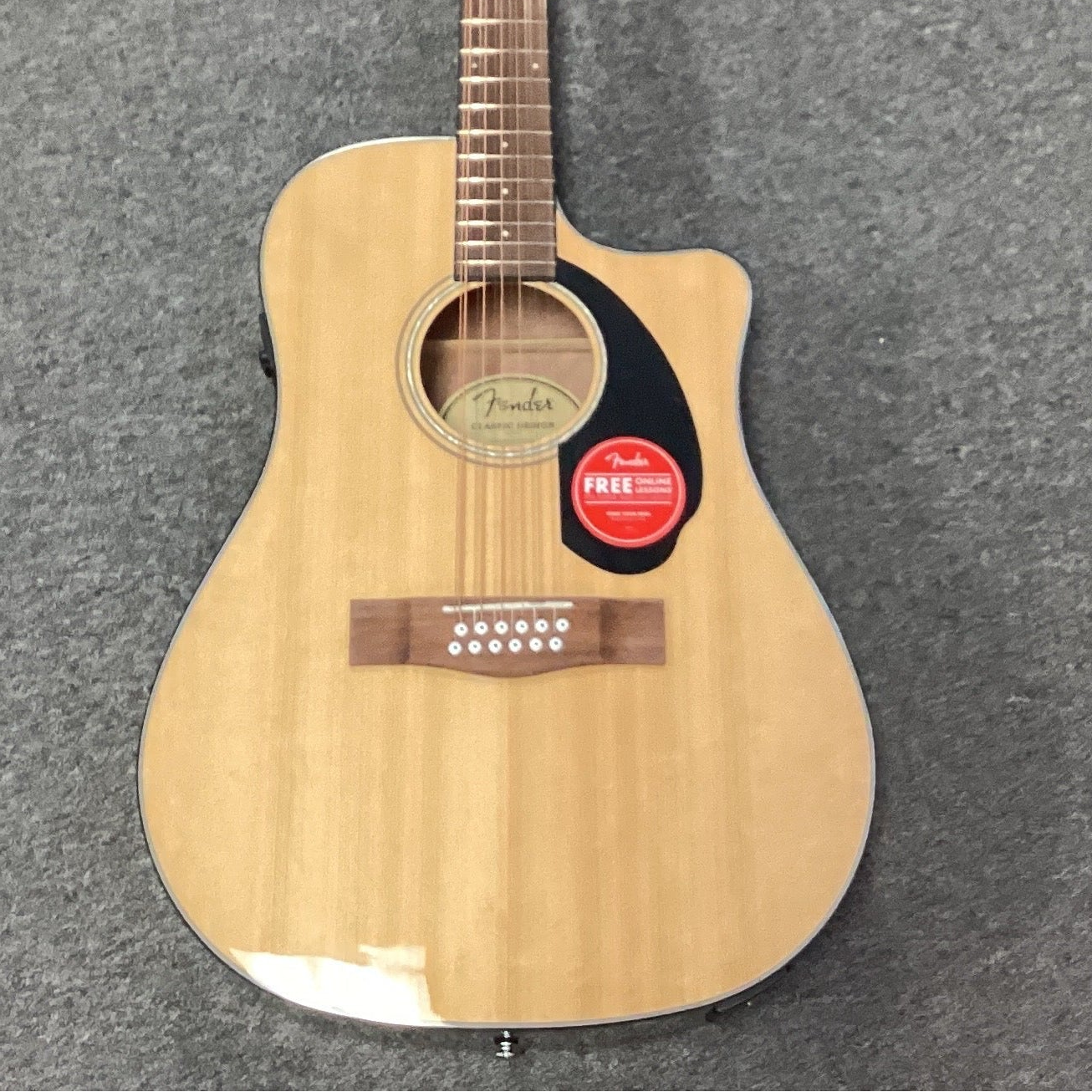 Image of Acoustic guitar on a gray surface