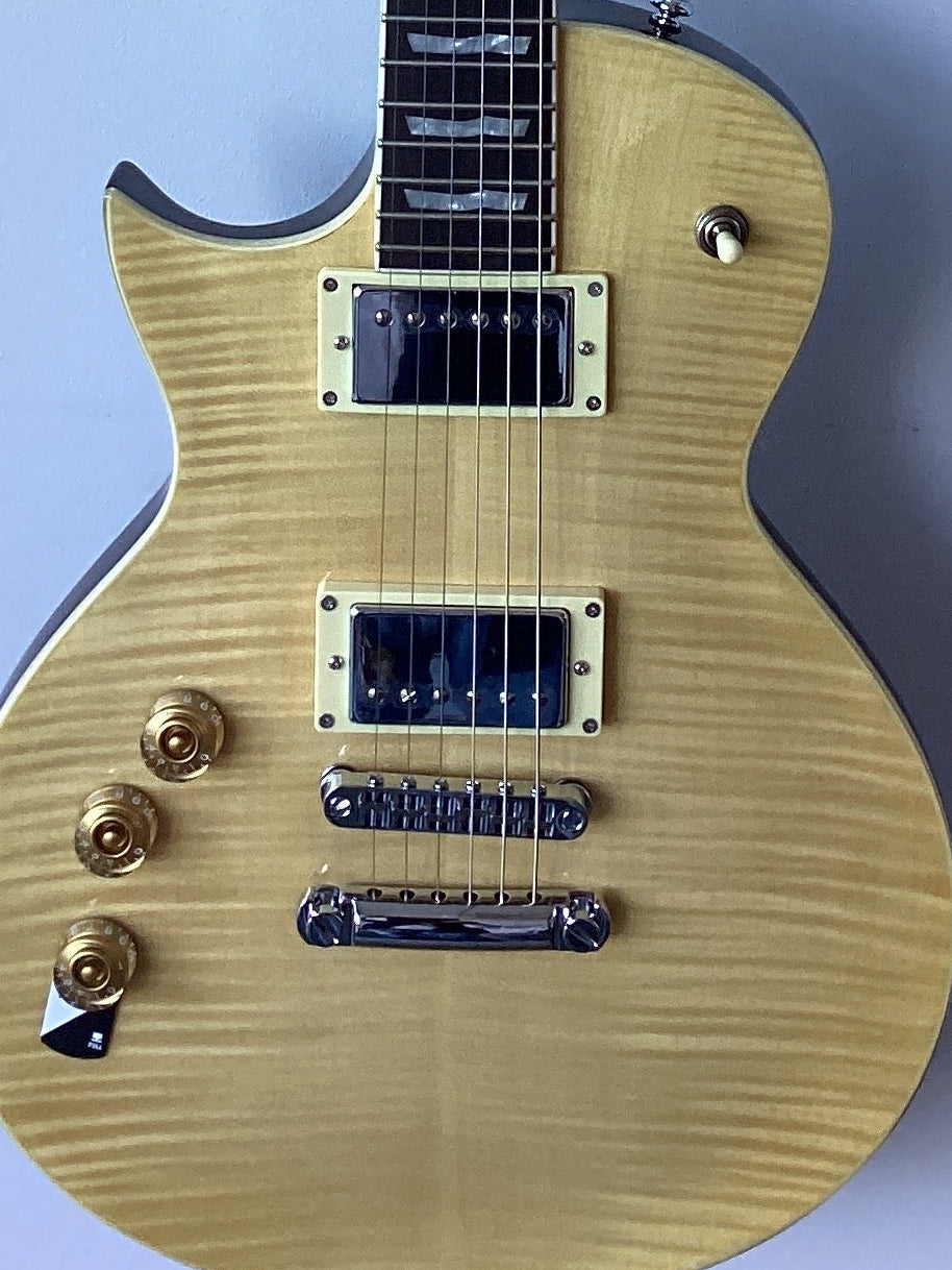 Image of Electric guitar with a blonde finish on a white background