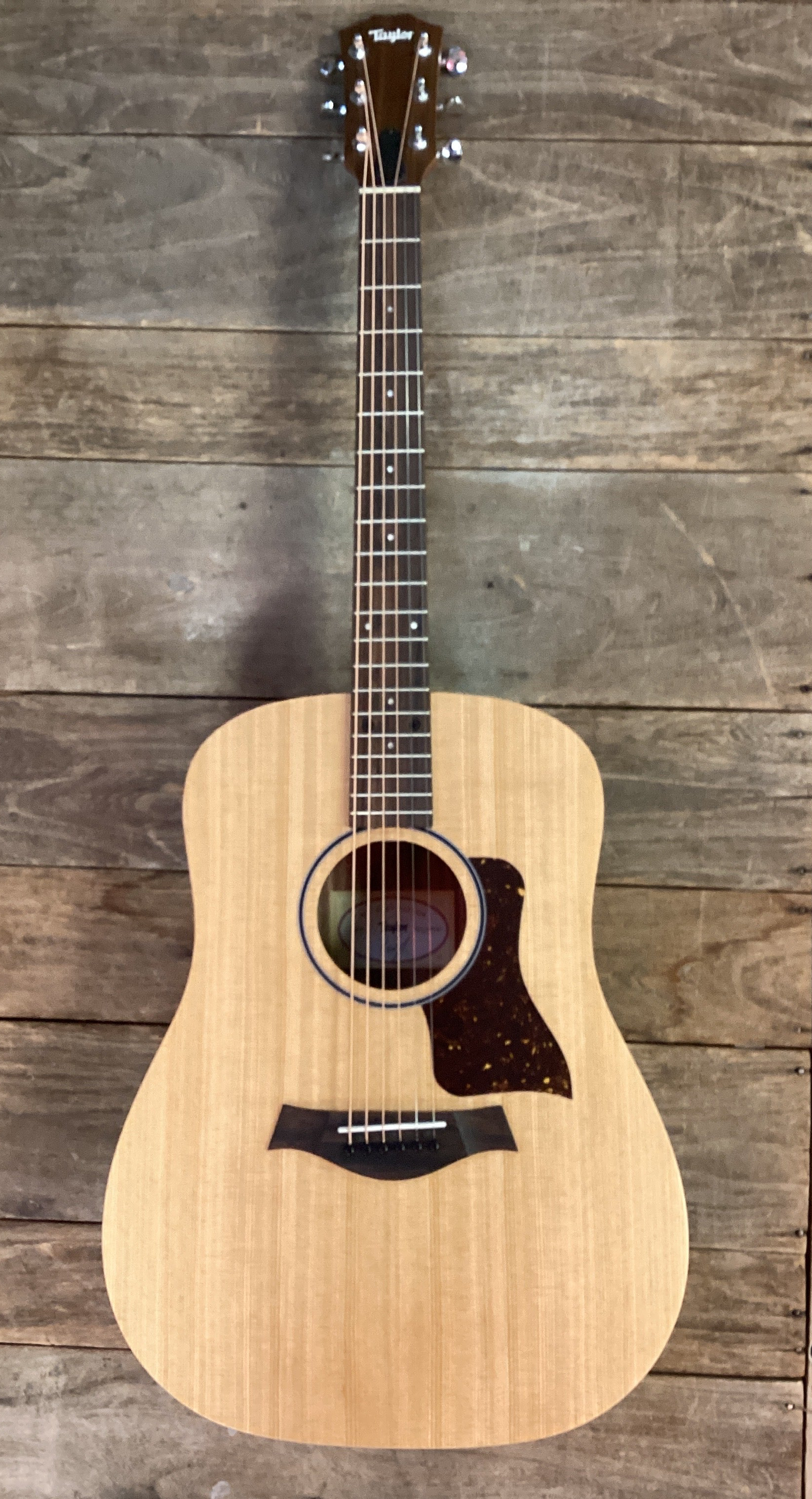 Image of Acoustic guitar on a wooden background