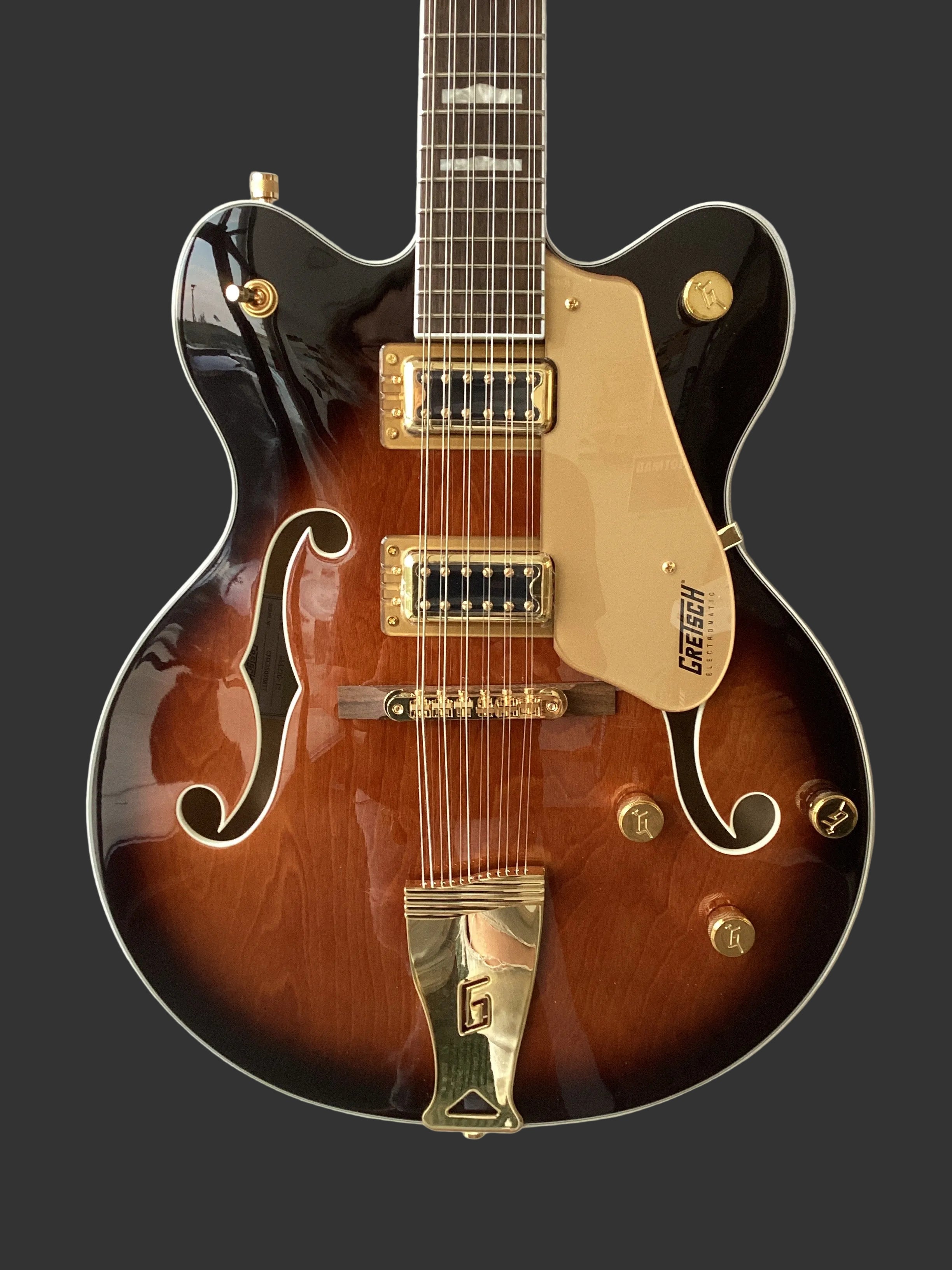 Image of Gibson electric guitar with a sunburst finish on a black background