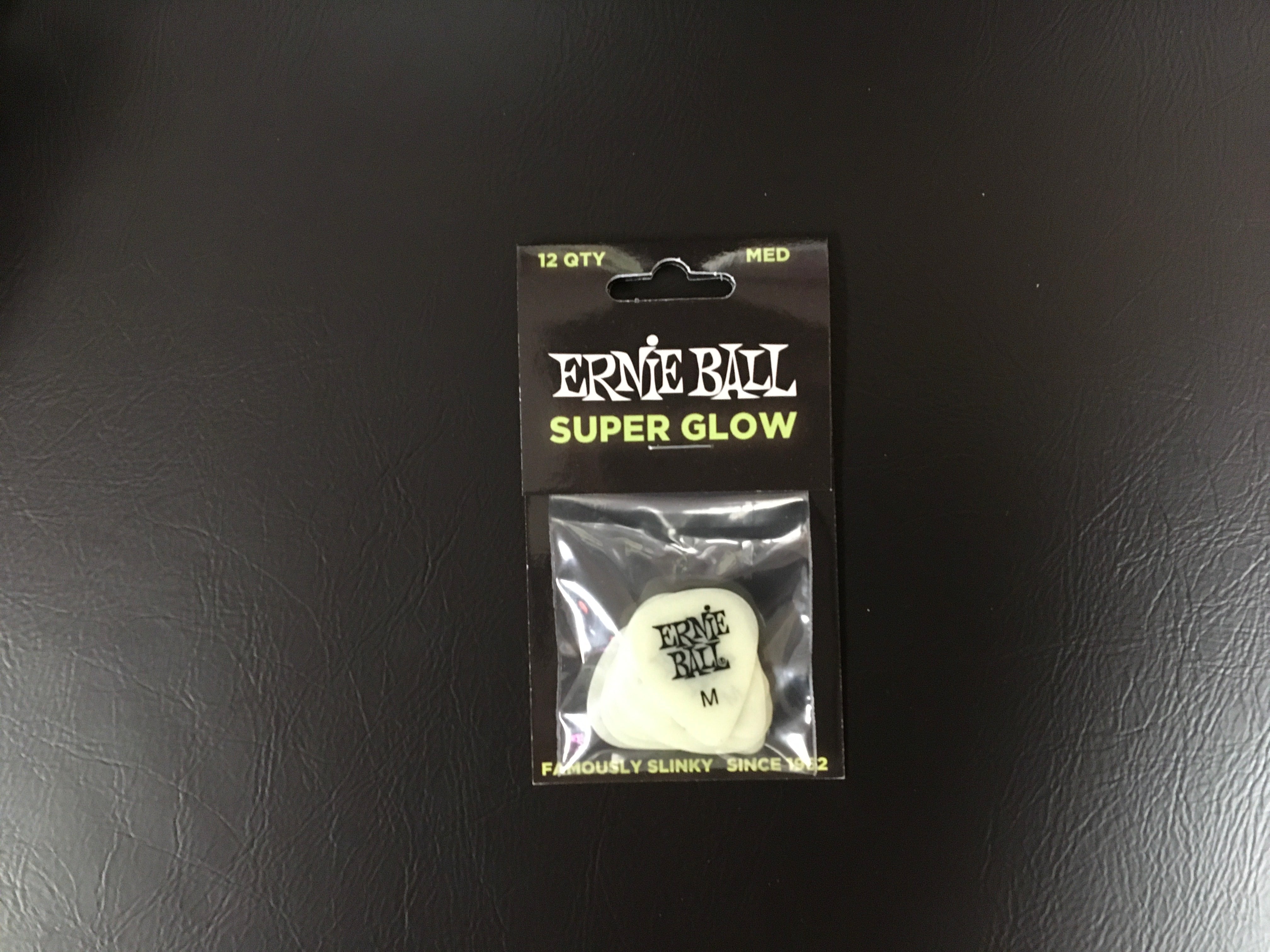Image of Ernie Ball Cellulose Guitar Picks - Medium Super Glow - 12 Pack