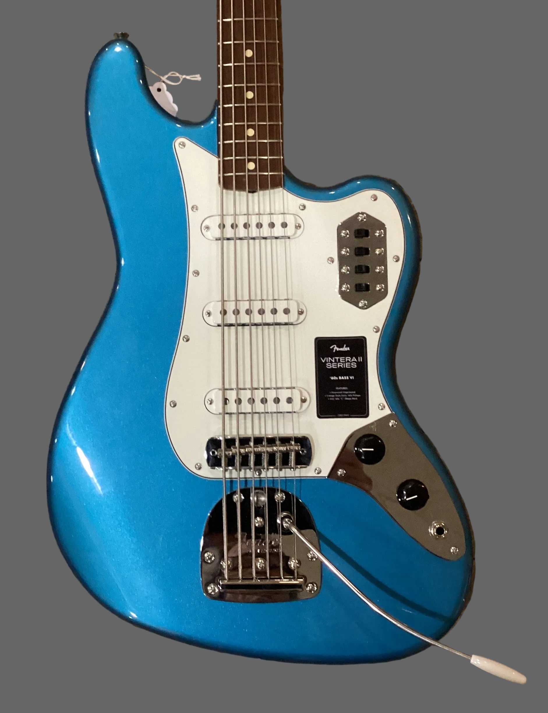 Image of Blue electric guitar on a wooden surface