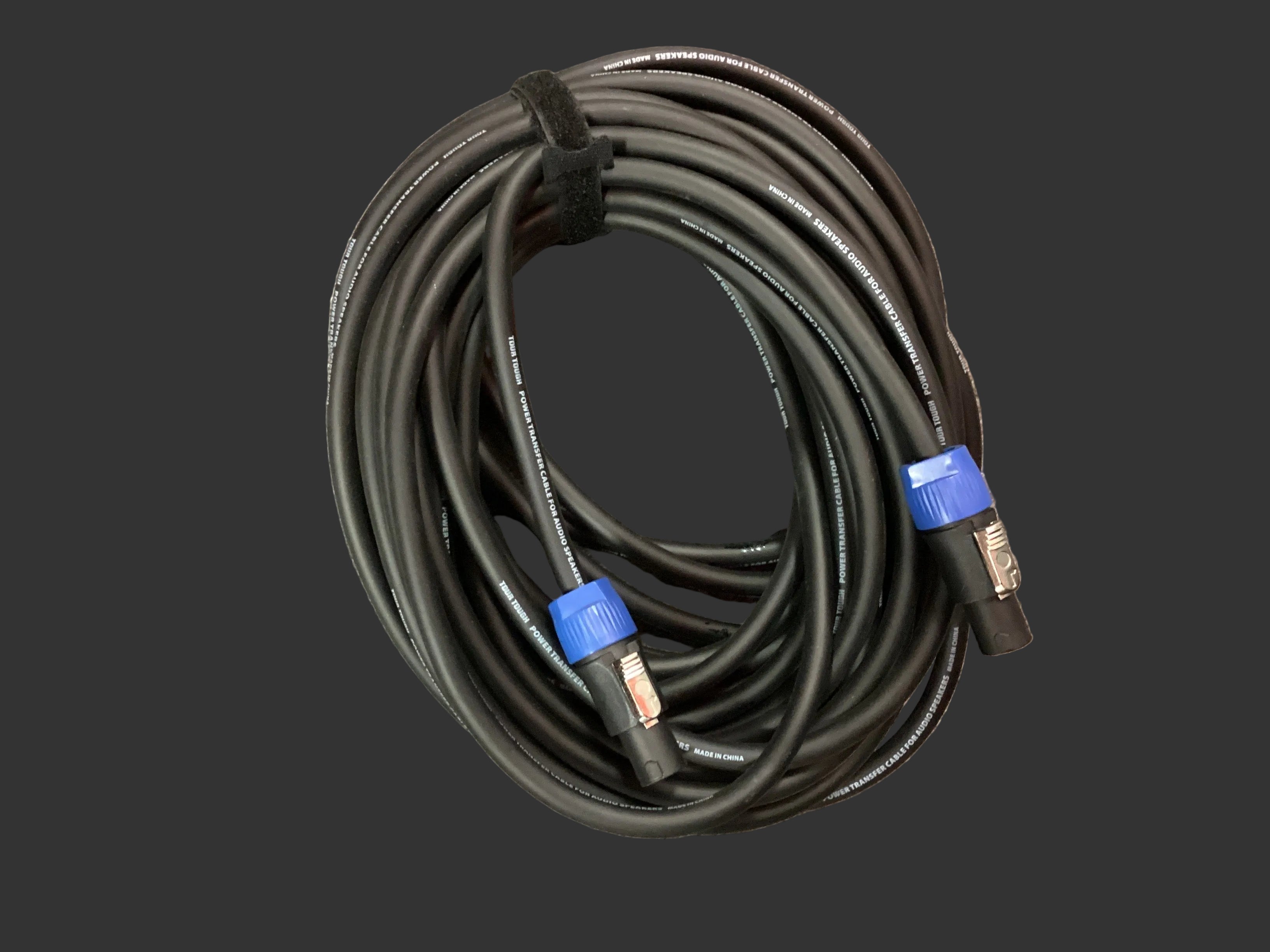 Image of Coiled black cable with blue connectors on a gray surface